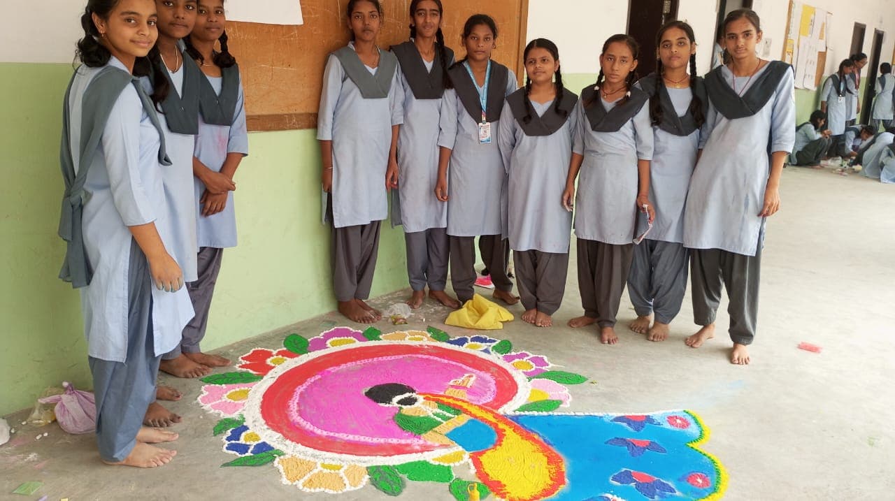 Students creating rangoli art